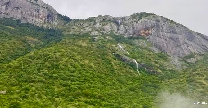 Multiple seasonal waterfalls flowing down Western Ghats mountain slopes near Pollachi